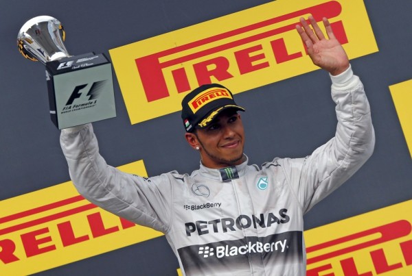 Third placed Mercedes Formula One driver Lewis Hamilton of Britain celebrates after the Hungarian F1 Grand Prix at the Hungaroring circuit, near Budapest