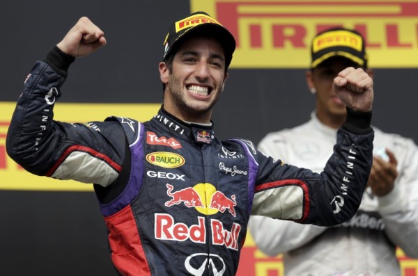 Winner Red Bull Formula One driver Ricciardo of Australia celebrates in front of third placed Mercedes Formula One driver Hamilton of Britain after the Hungarian F1 Grand Prix at the Hungaroring circuit, near Budapest